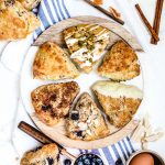 Variety of buttermilk scones on tray with ingredients around