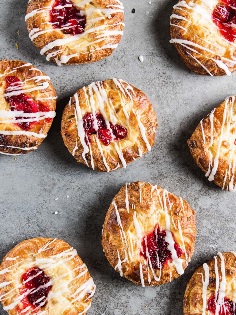 8 Danishes on board with cranberry compote and drizzle on top.