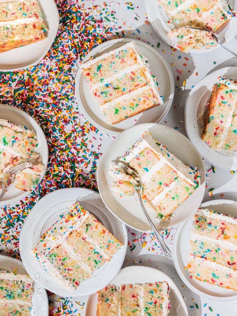 10 slices of Homemade Confetti Cake on plates