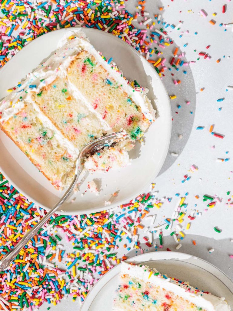 Slice of Homemade Confetti Cake on plate with fork