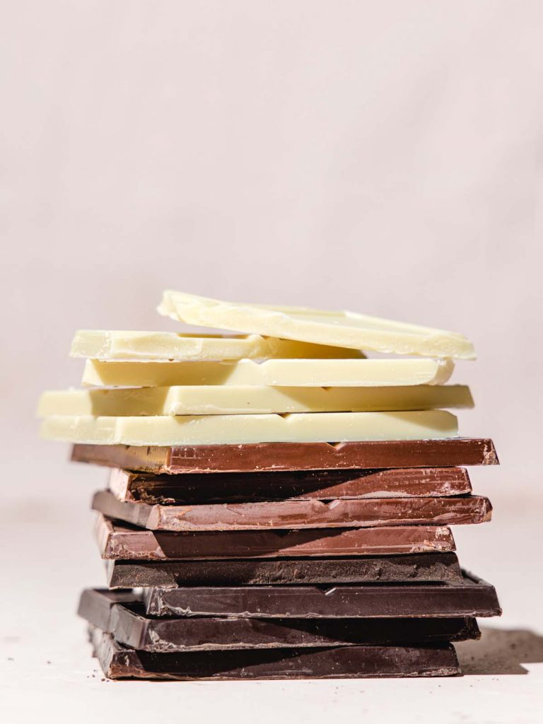 Stack of chocolate bars in three flavors.