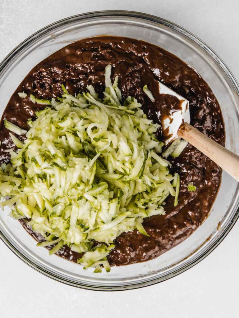 Chocolate muffin batter with grated zucchini.