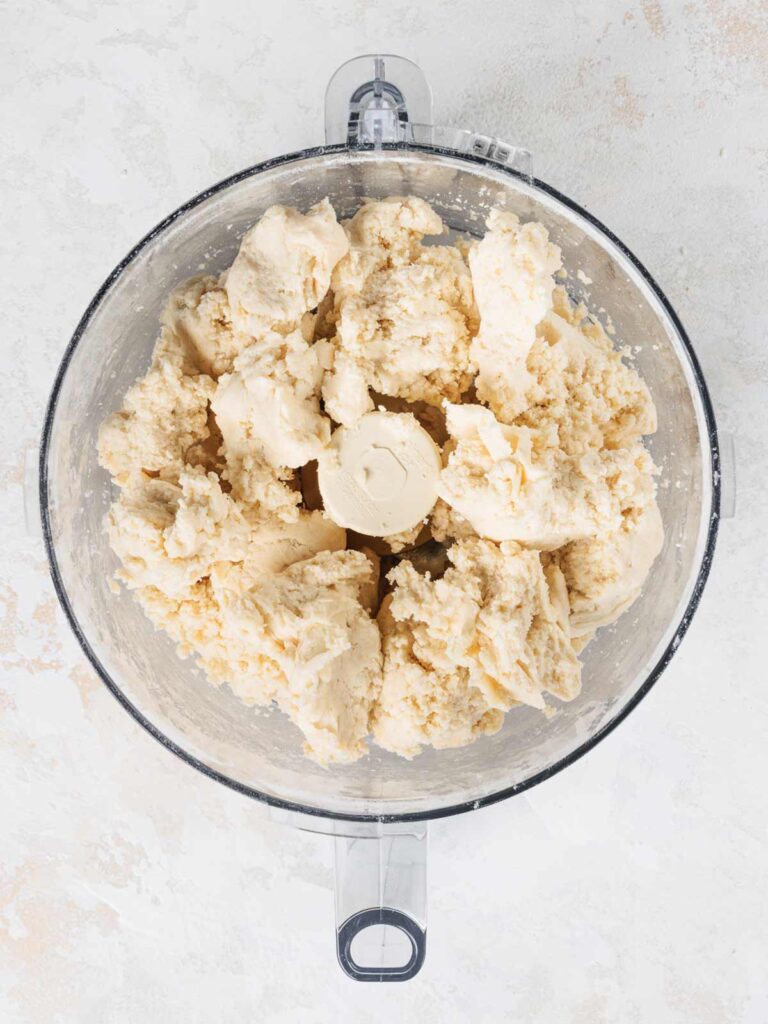 Crust dough in food processor bowl.