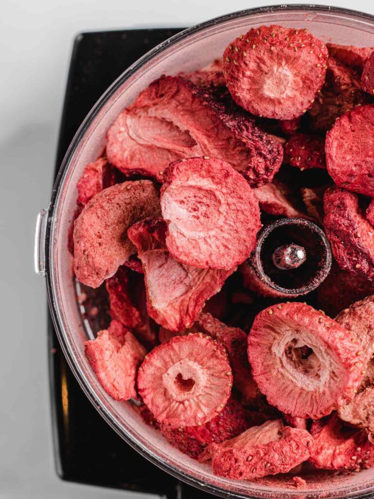 Freeze-dried strawberry slices in food processor.