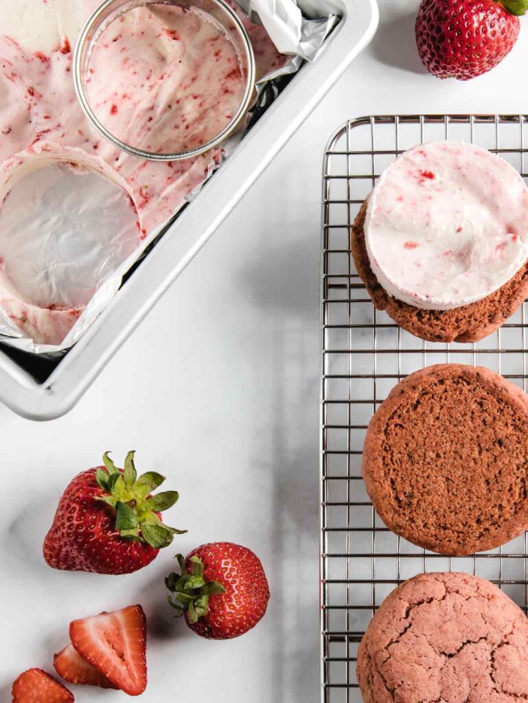 Cooling rack with strawberry cookies and ice cream pan.