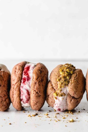 Ice cream sandwiches on side with pistachios.