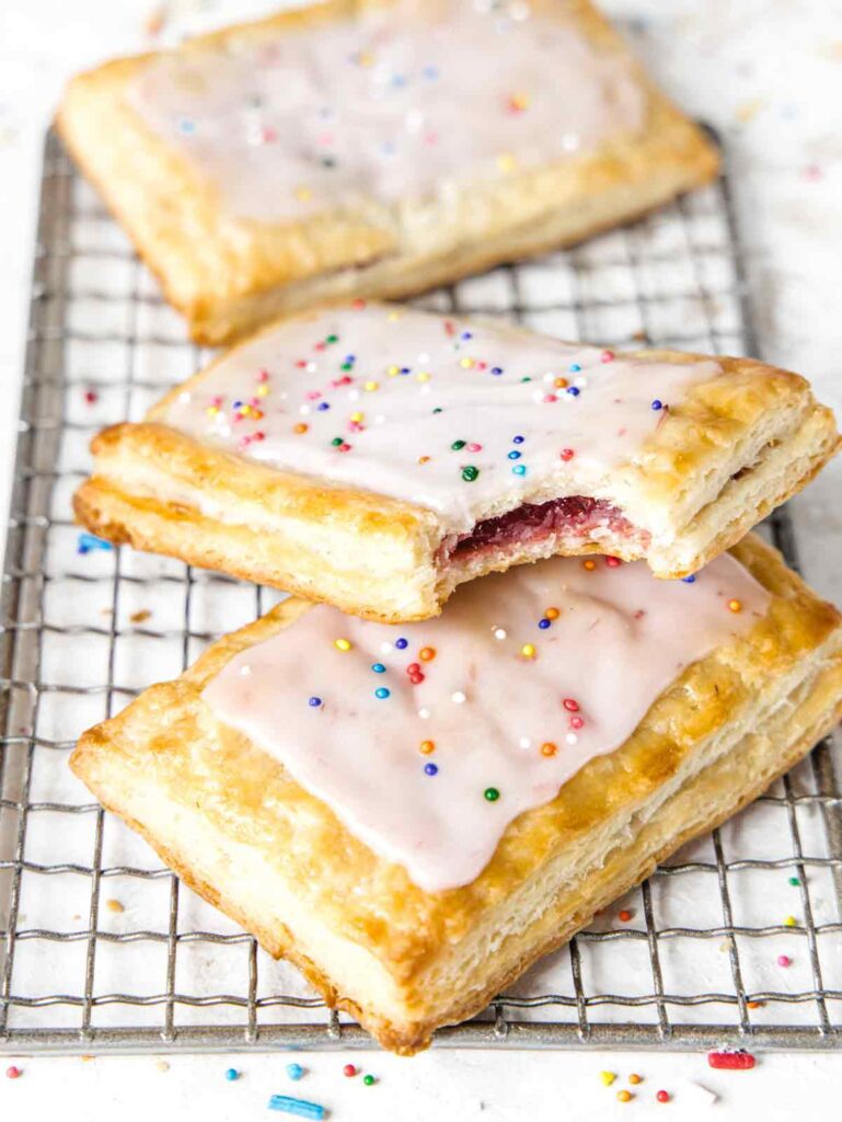 Close up of bite removed from strawberry pop tart.