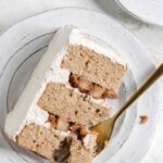 Close up of cake on plate with fork.