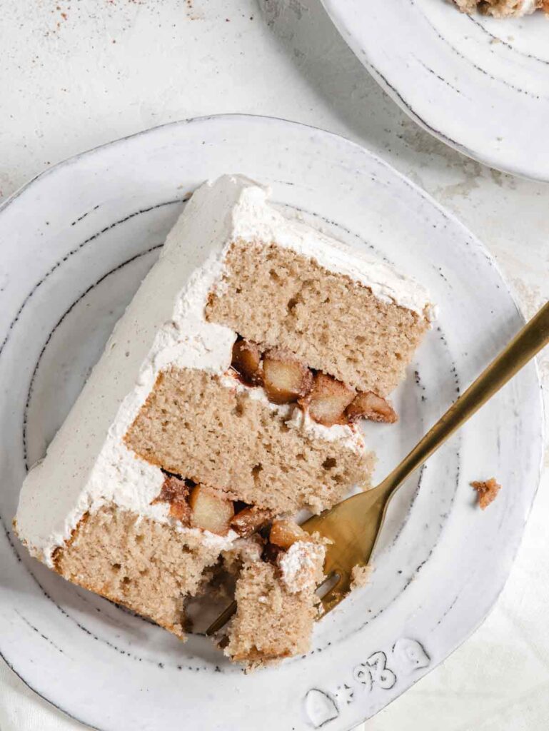 Close up of cake on plate with fork.