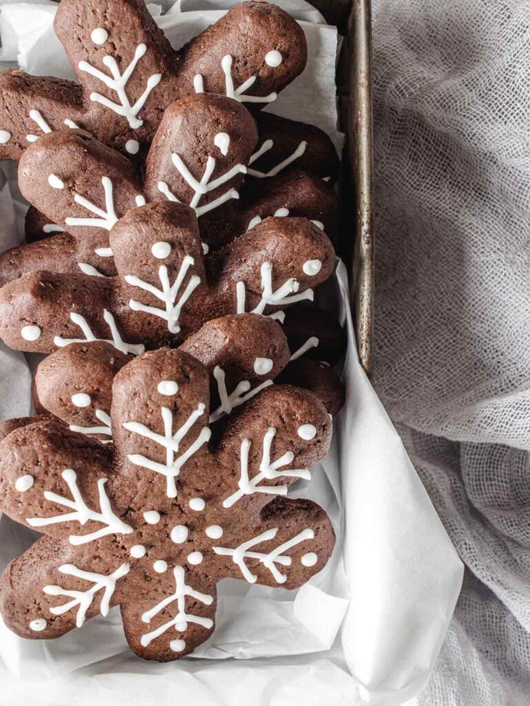 Close up of snowflake cookies in tin.