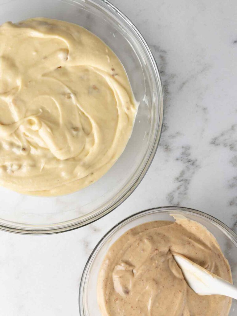 Two bowls of apple cake batter in bowls.