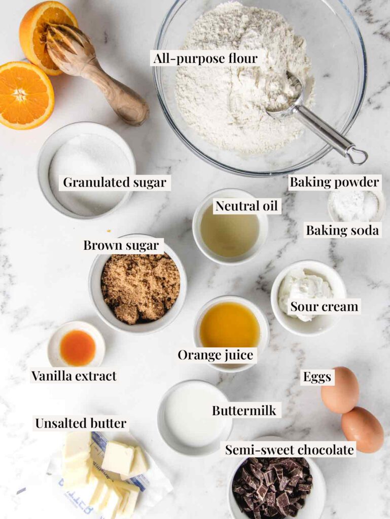 Ingredients for chocolate and orange muffins with labels.