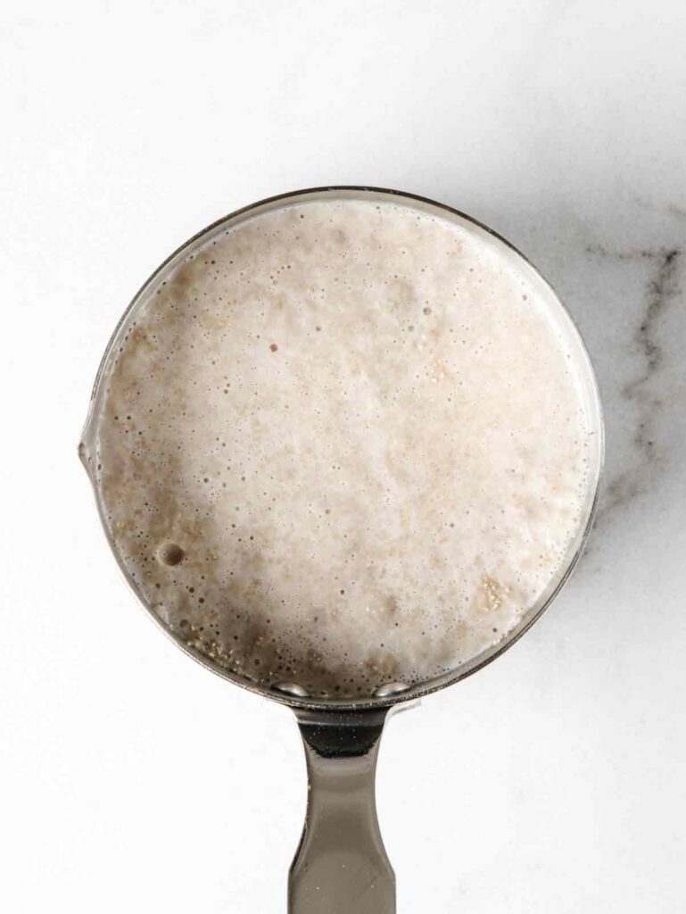 Activated frothy yeast in saucepan.