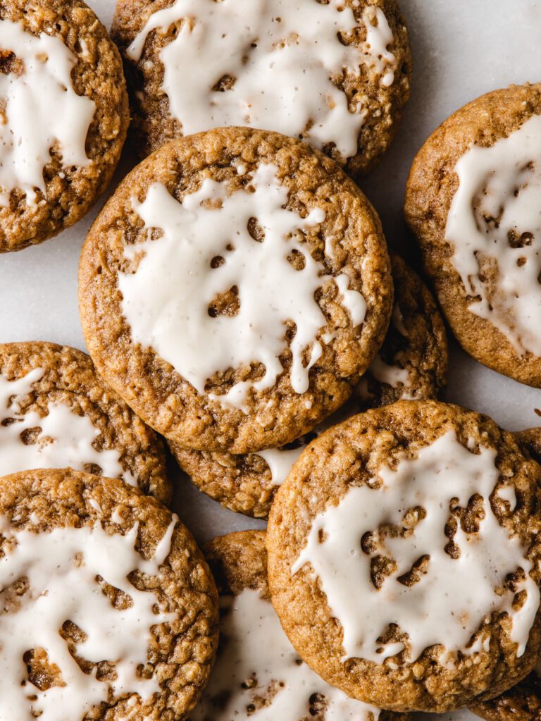 Pile of cookies with icing on top.