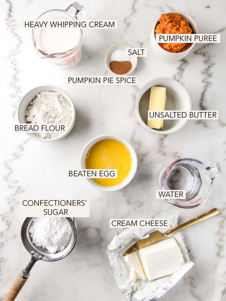 Ingredients for pumpkin pie cream puffs on table with labels.