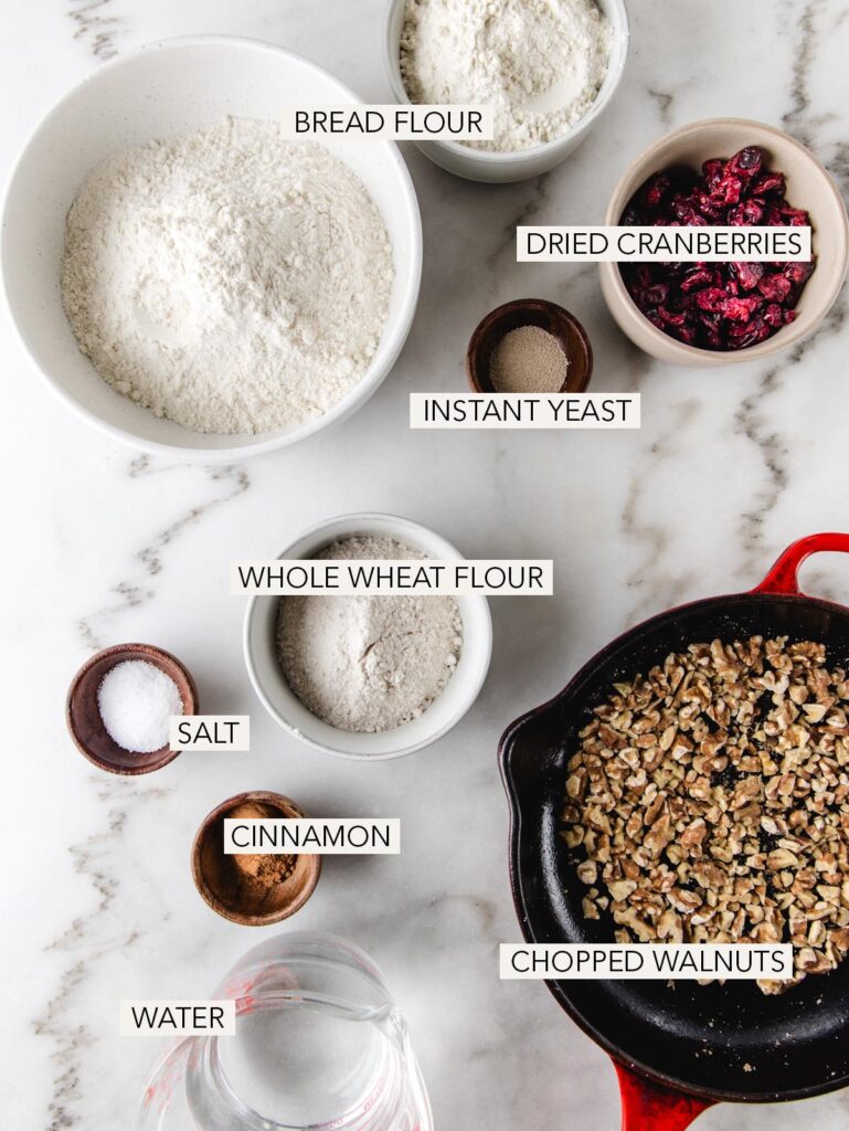 Ingredients for cranberry walnut bread with labels.