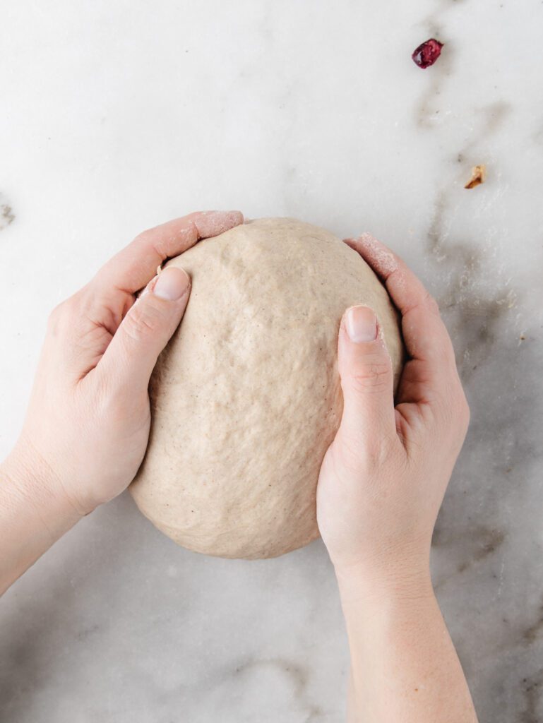 Shaping dough into ball.