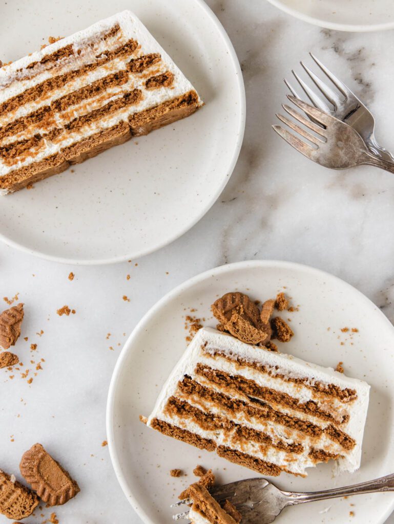 Two slices of cake on plates with fork removing one piece.