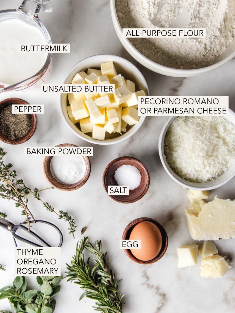 Ingredients for herb scones in bowls with labels.