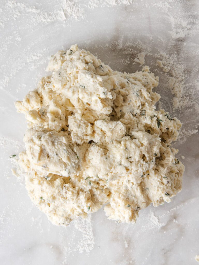 Scone dough on marble table.