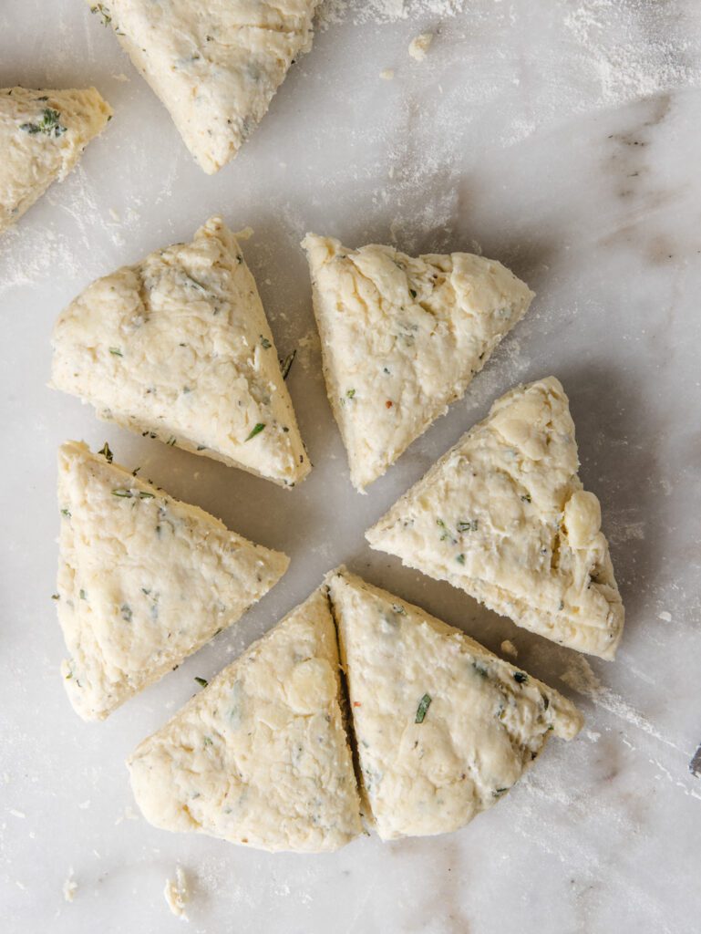 Cutting scone dough into wedges.