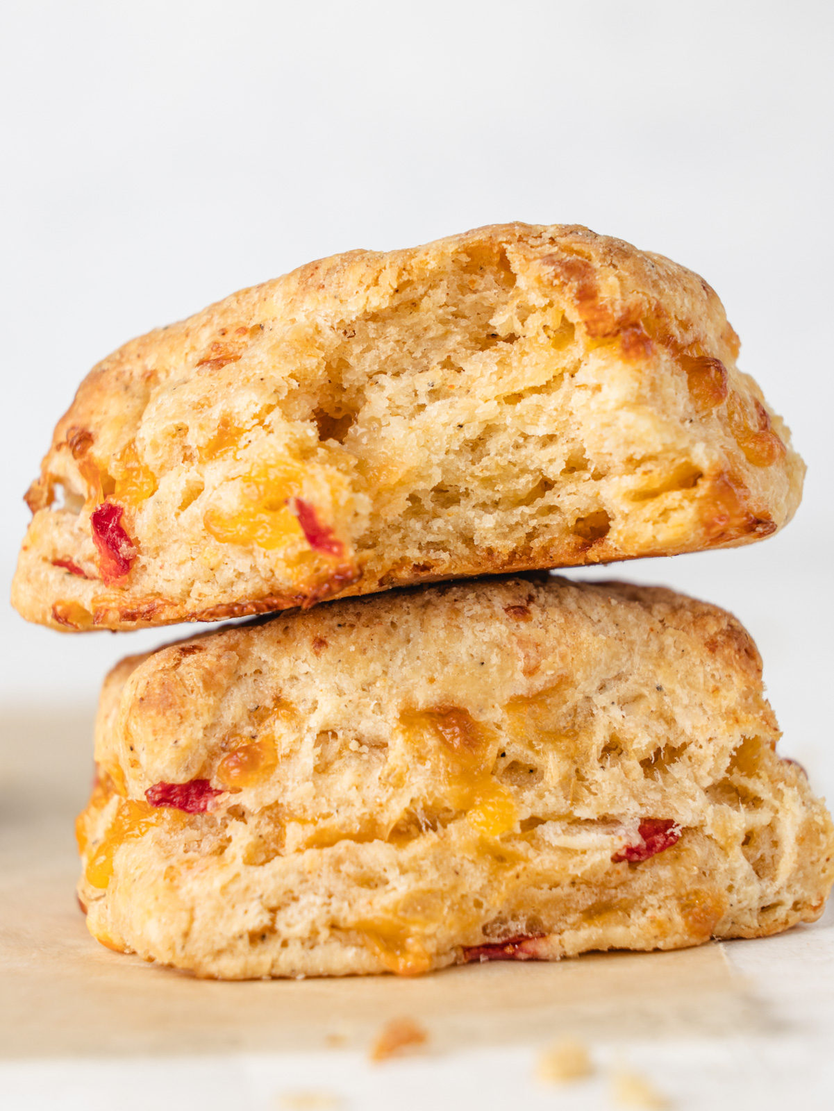 Two biscuits sitting on top of each other.