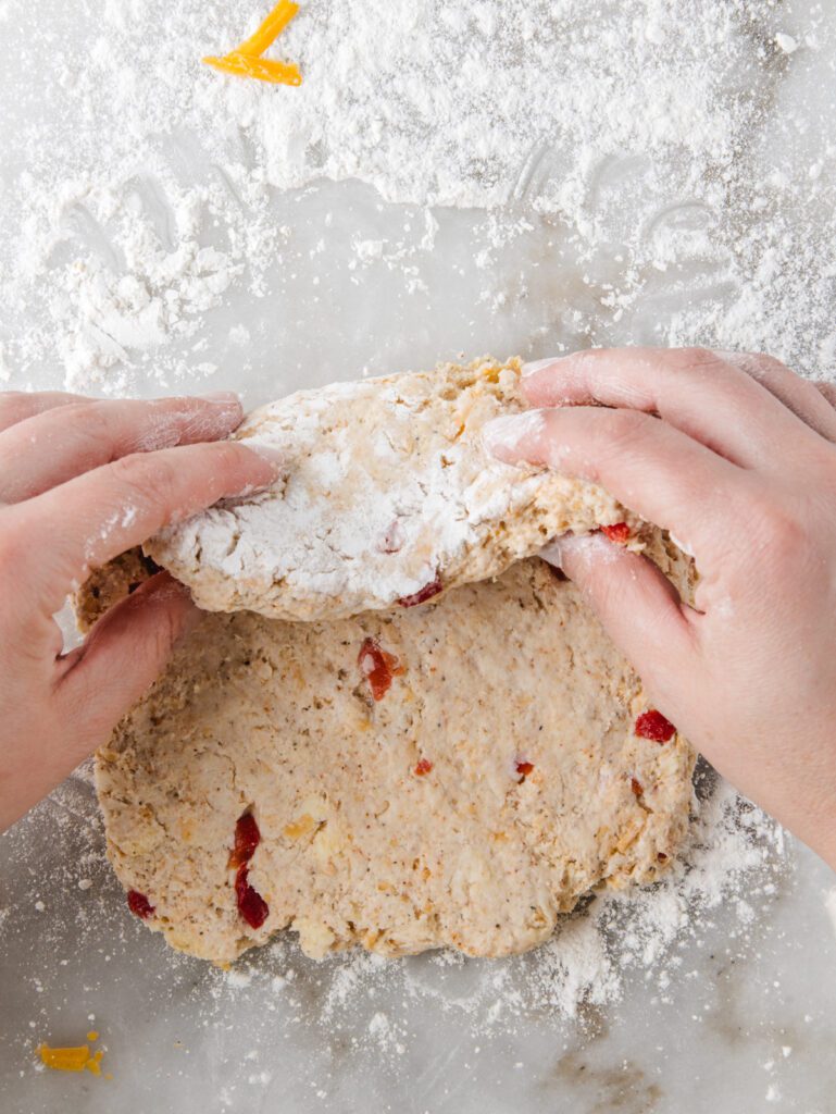 Folding biscuit dough in thirds.
