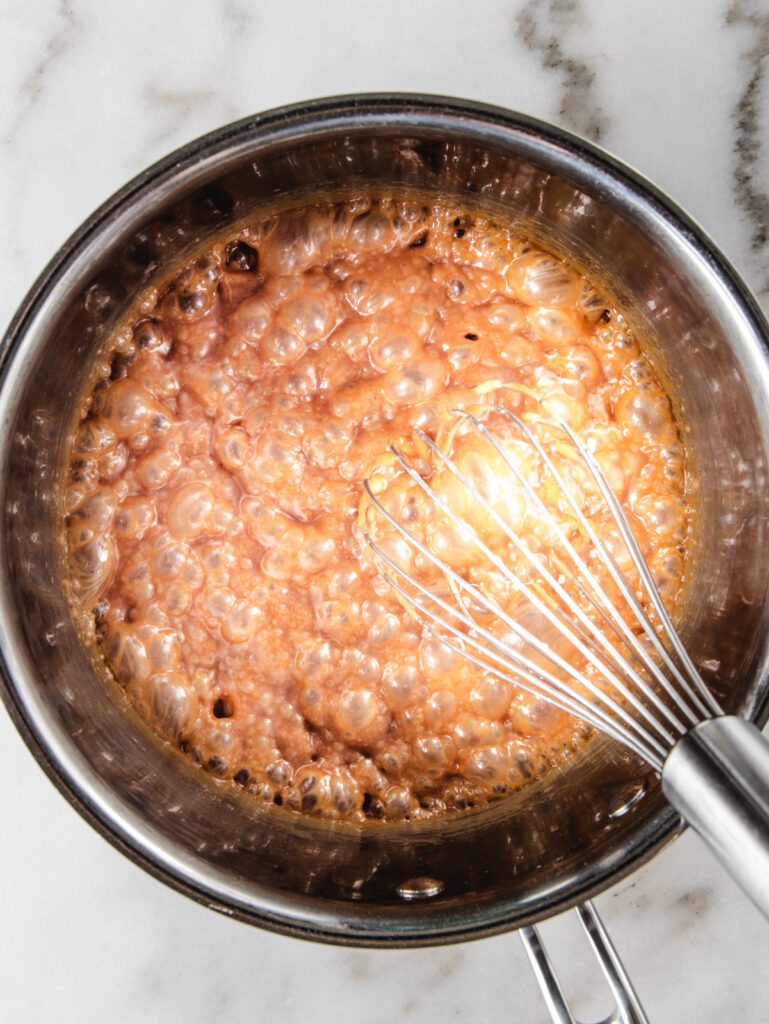 Caramel bubbling in pan.