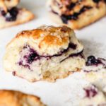 Side of scone broken in half with swirls of jam in the middle.